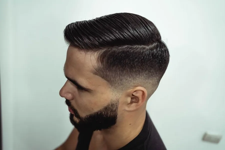 Men's side part with fade and beard