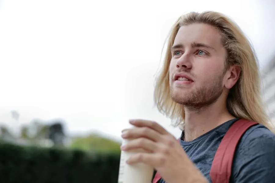 Men's loose wavy hair, grown out